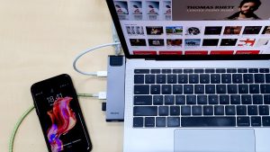 A MacBook and an iPhone Connected To a Baseus Docking station.